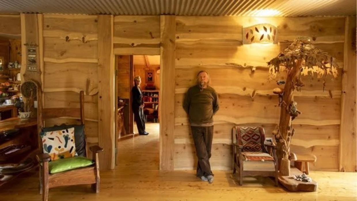 Brian and Karen Cooper at home in their Golden Bay property, Weka Workshop