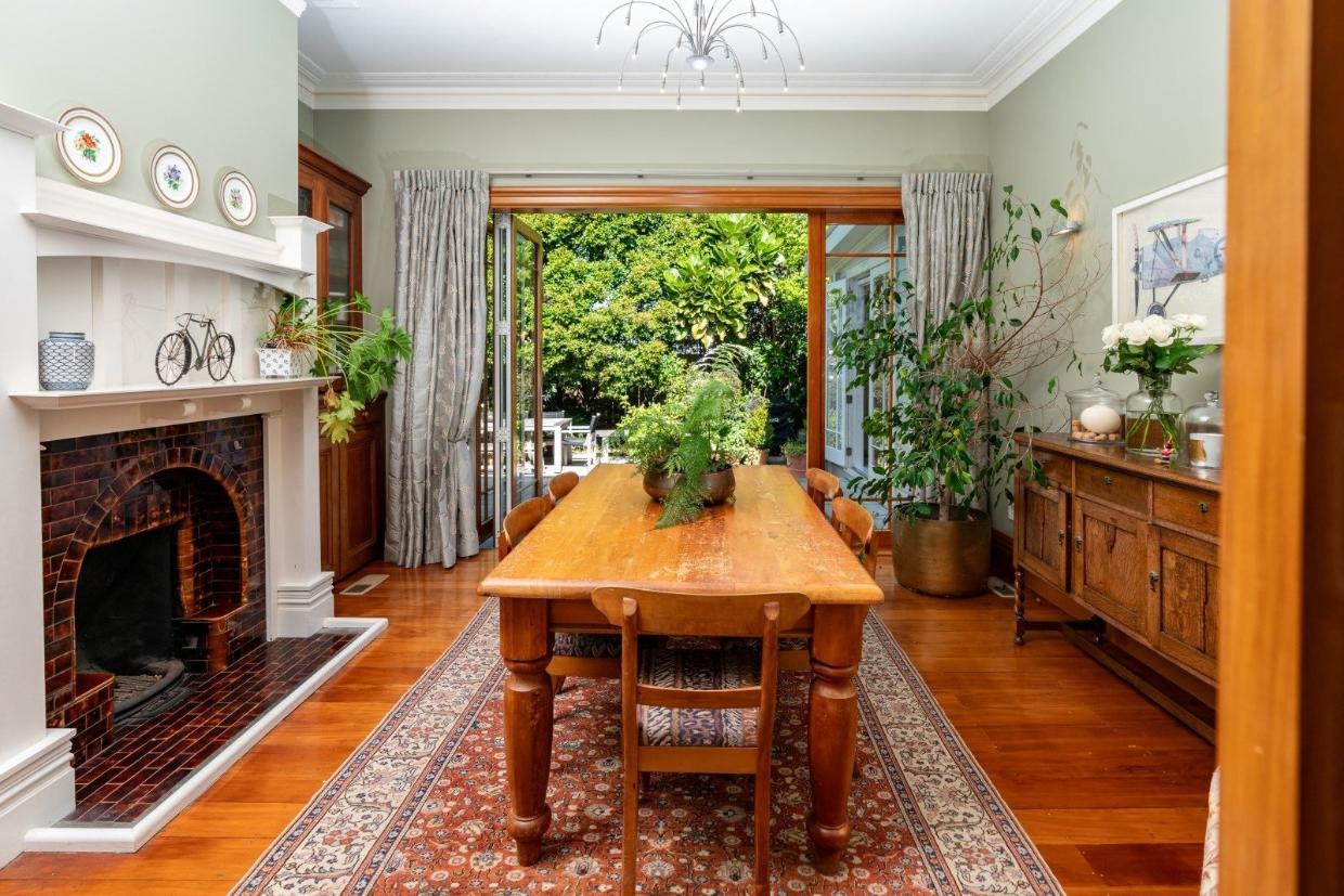 The formal dining room opens onto the courtyard garden.