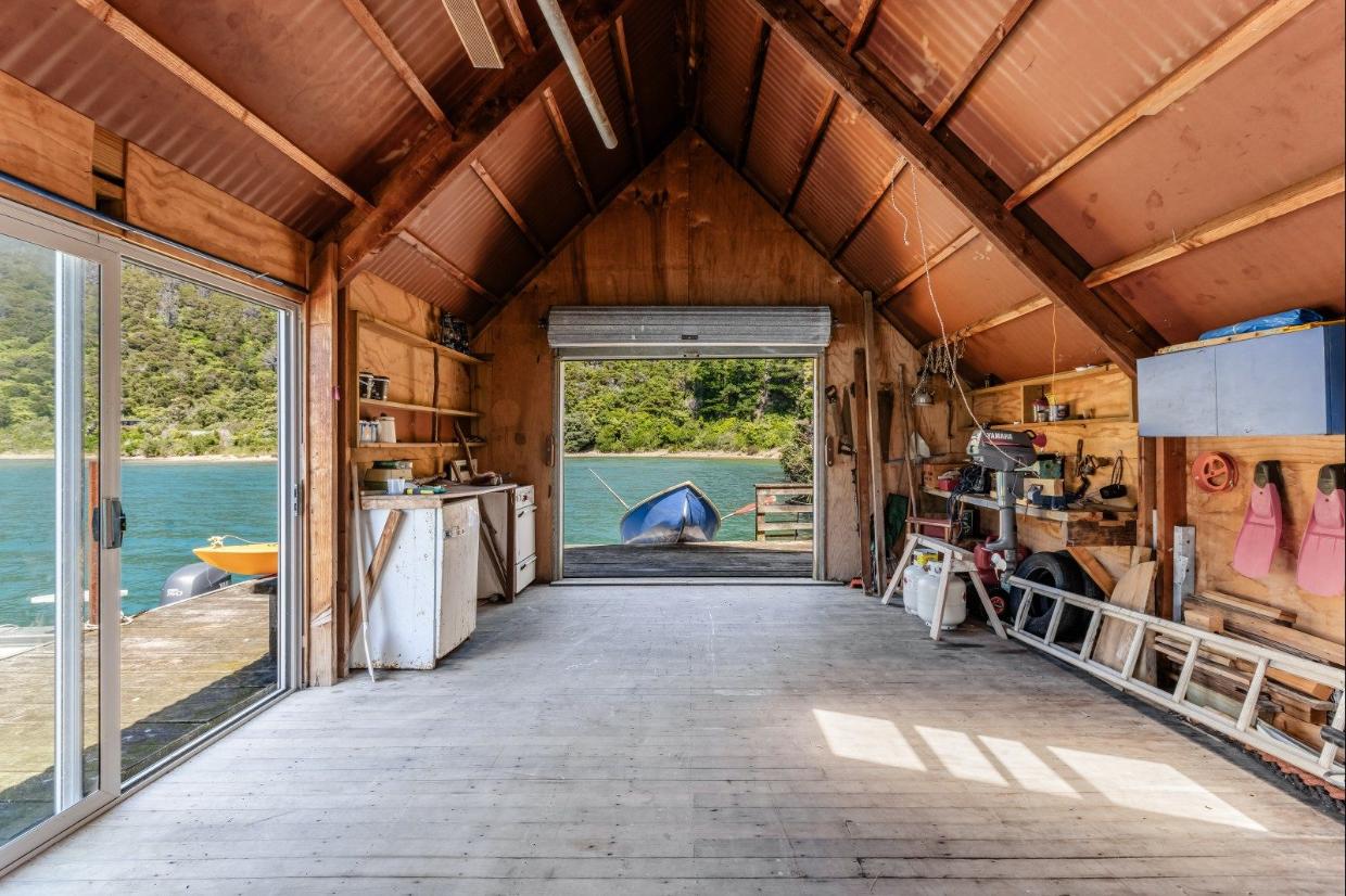Even the boatshed is a work of fine craftsmanship. There is space to store all the “toys”.
