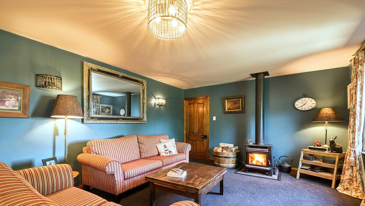 A second room with a fire place is where the couple retreat during the colder winter months.