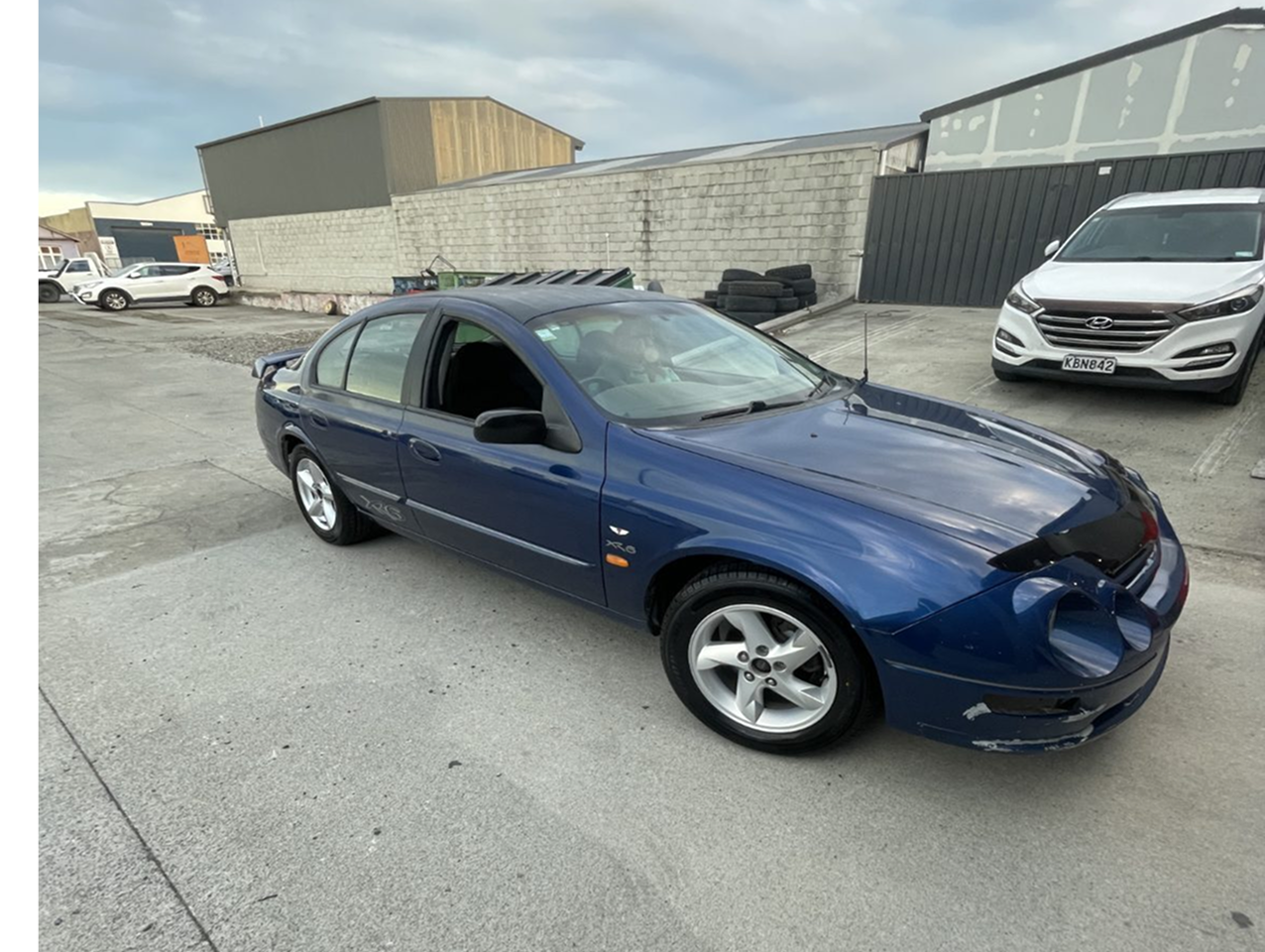 Blue Ford Falcon parked in a car park