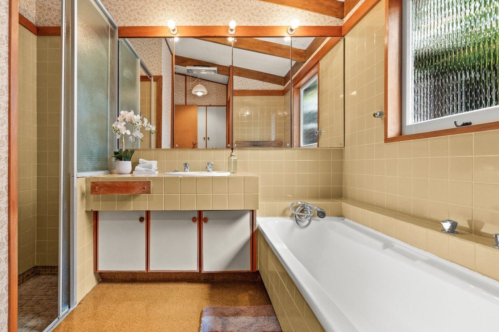 Two mid-century style bathrooms.