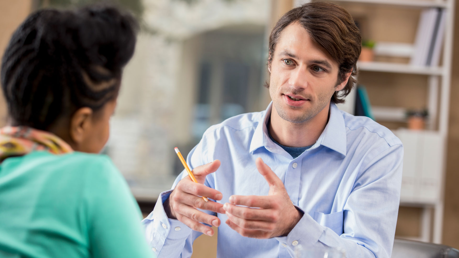 Interviewee explaining his past performance in a job interview.