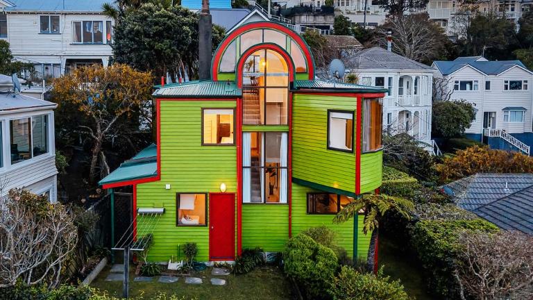 Standing out among a sea of traditional Kelburn villas, this colourful house makes just as much of a statement as it did when architect Ross Brown designed it for himself in 1982. Photo: Harcourts