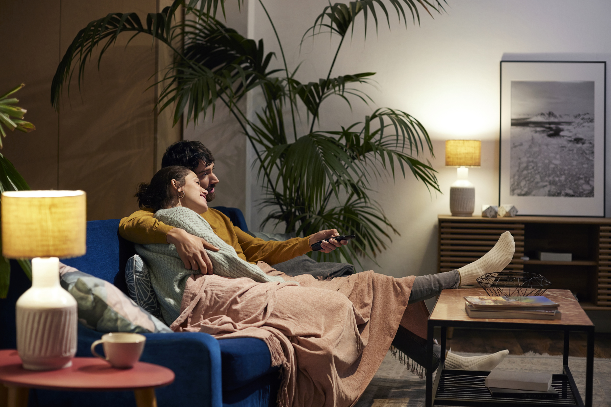 Couple on the couch in a cosy home setting