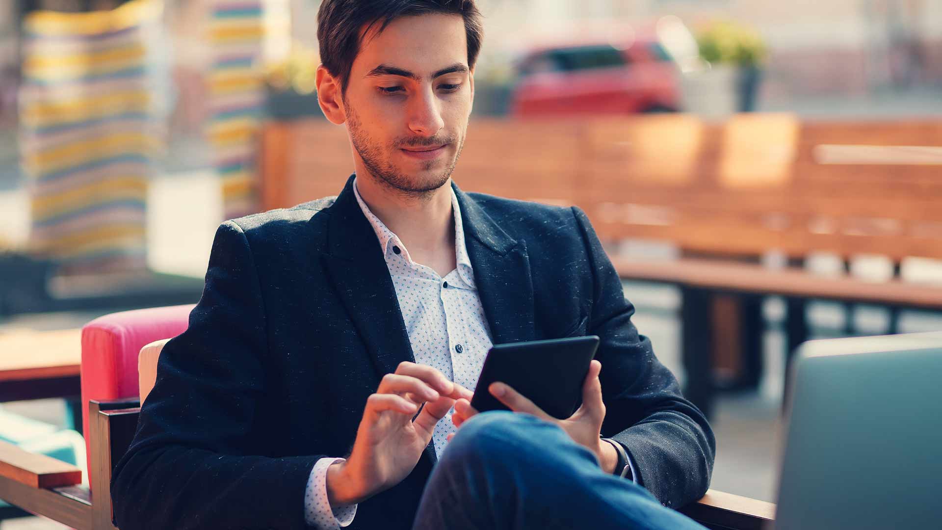 Young empoyee working on a tablet.