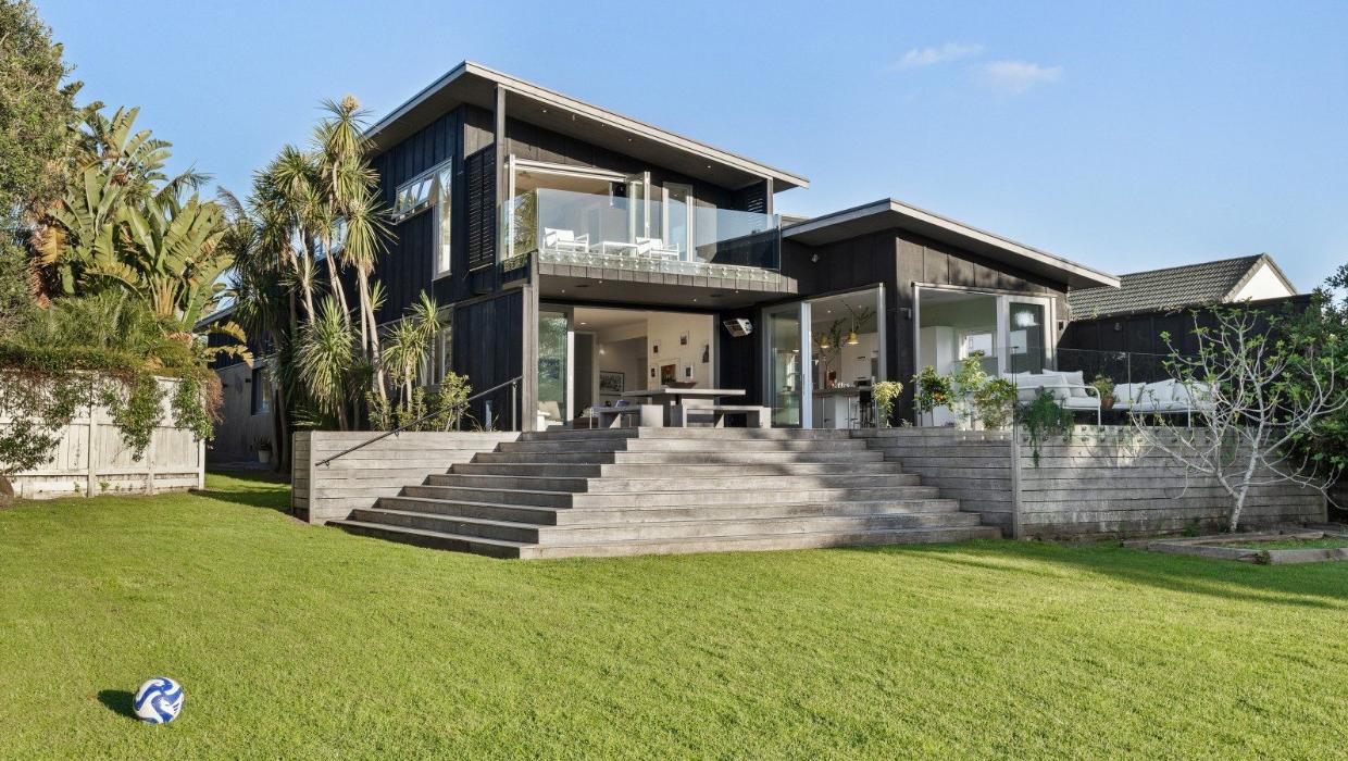 Owners Anthony and Rebecca undertook a huge renovation, adding a second storey to maximise the view. Photo: NZ Sotheby's