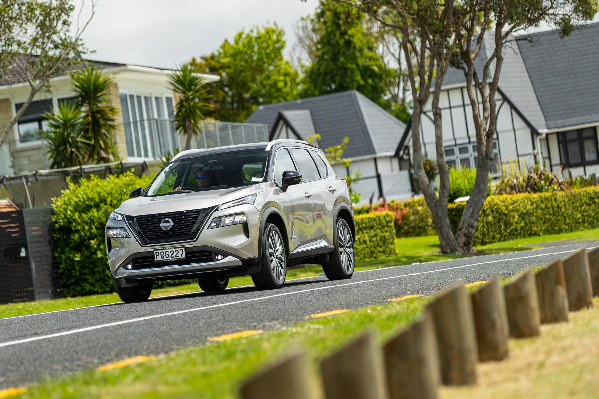 Gold Nissan X Trail E Power Ti Driving shot from the front.