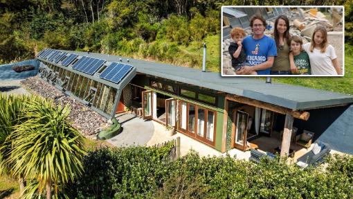 Coromandel’s sole Earthship house in Hikuai has come to market for the first time. Te Timatanga was built in 2015 by Sarah Rowe and Gus Anning. They are pictured with the children during the build. From left, Leo Anning, Gus, Sarah, Toby McNabb, Bryony McNabb. Photo: Pete May