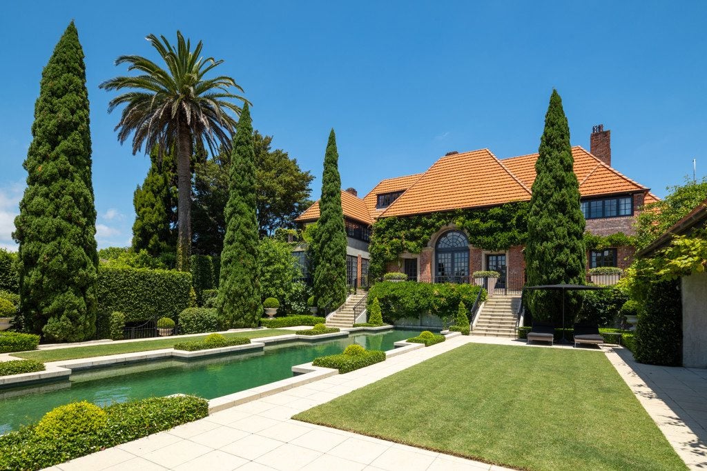 Luxury waterfront property with contemporary design, outdoor living space, and expansive water views.