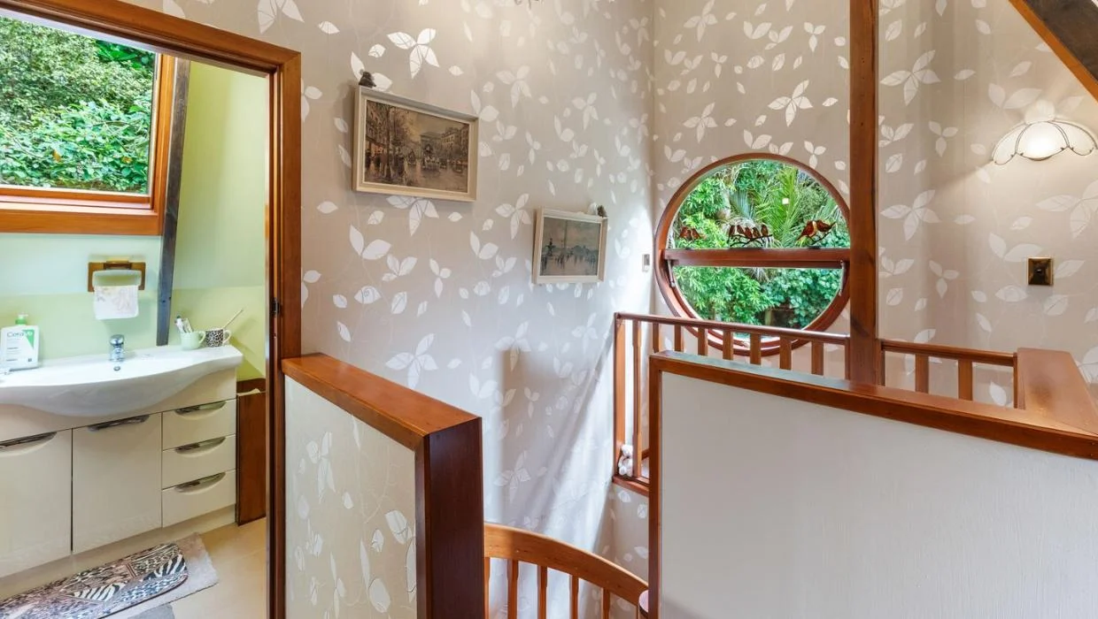 The home is dotted with interesting features, including porthole windows.