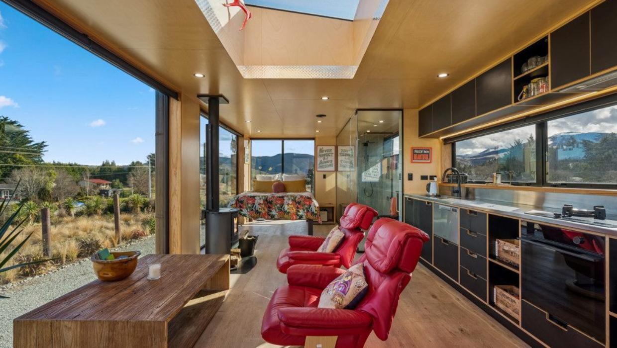 The home’s shape was inspired by his travels. Photo: COLLIERS/TRADE ME