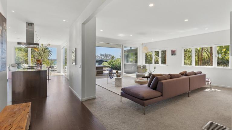 The main axis through the house leads the eye straight out to the water. Photo: NZ Sotheby's