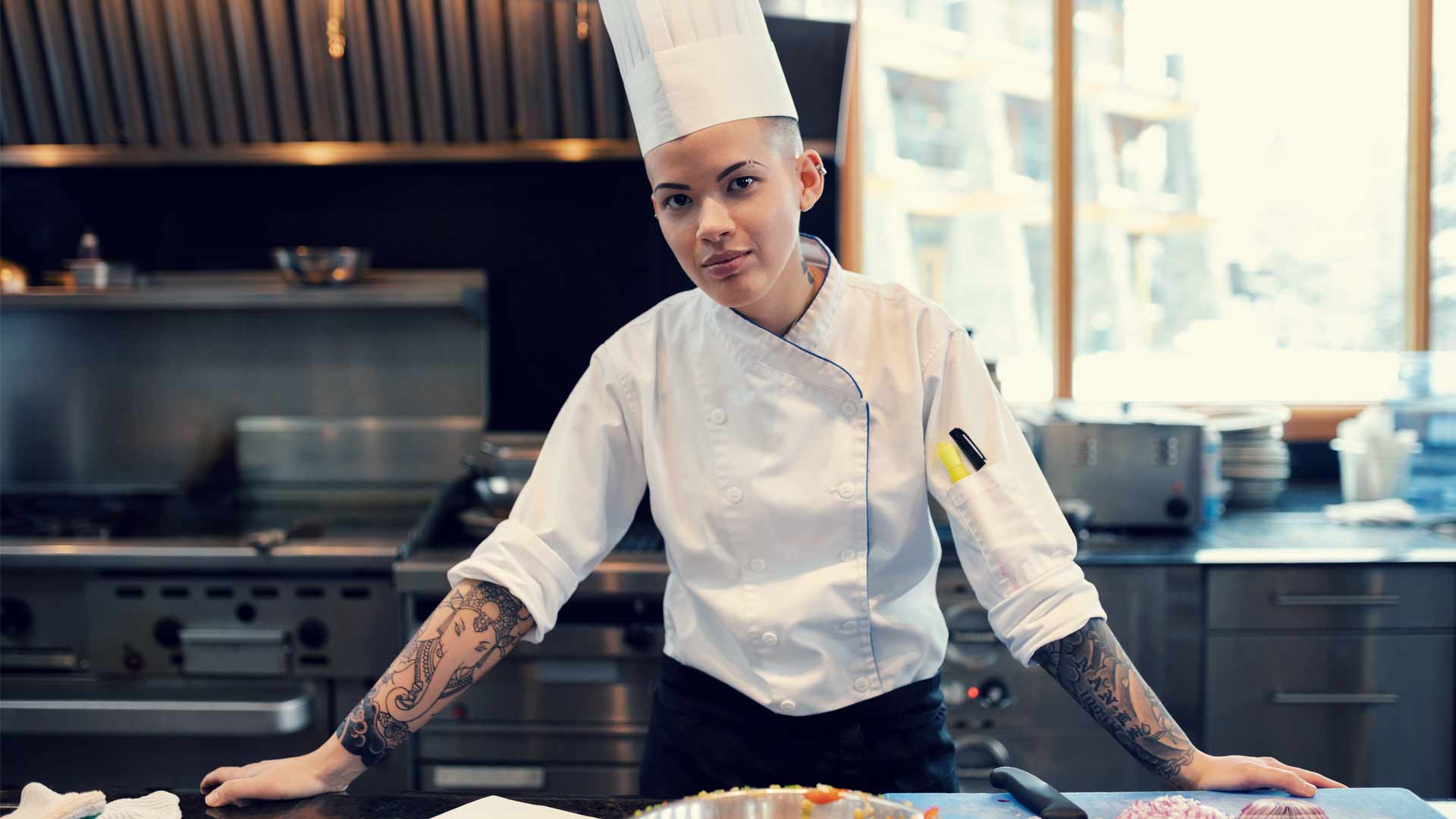 Chef standing at a counter in a kitchen
