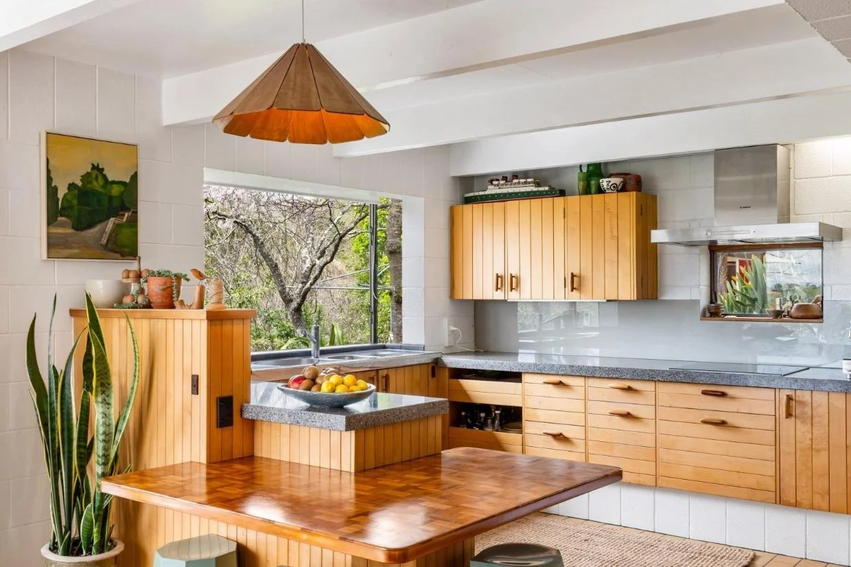 The kitchen cabinetry is also original. 