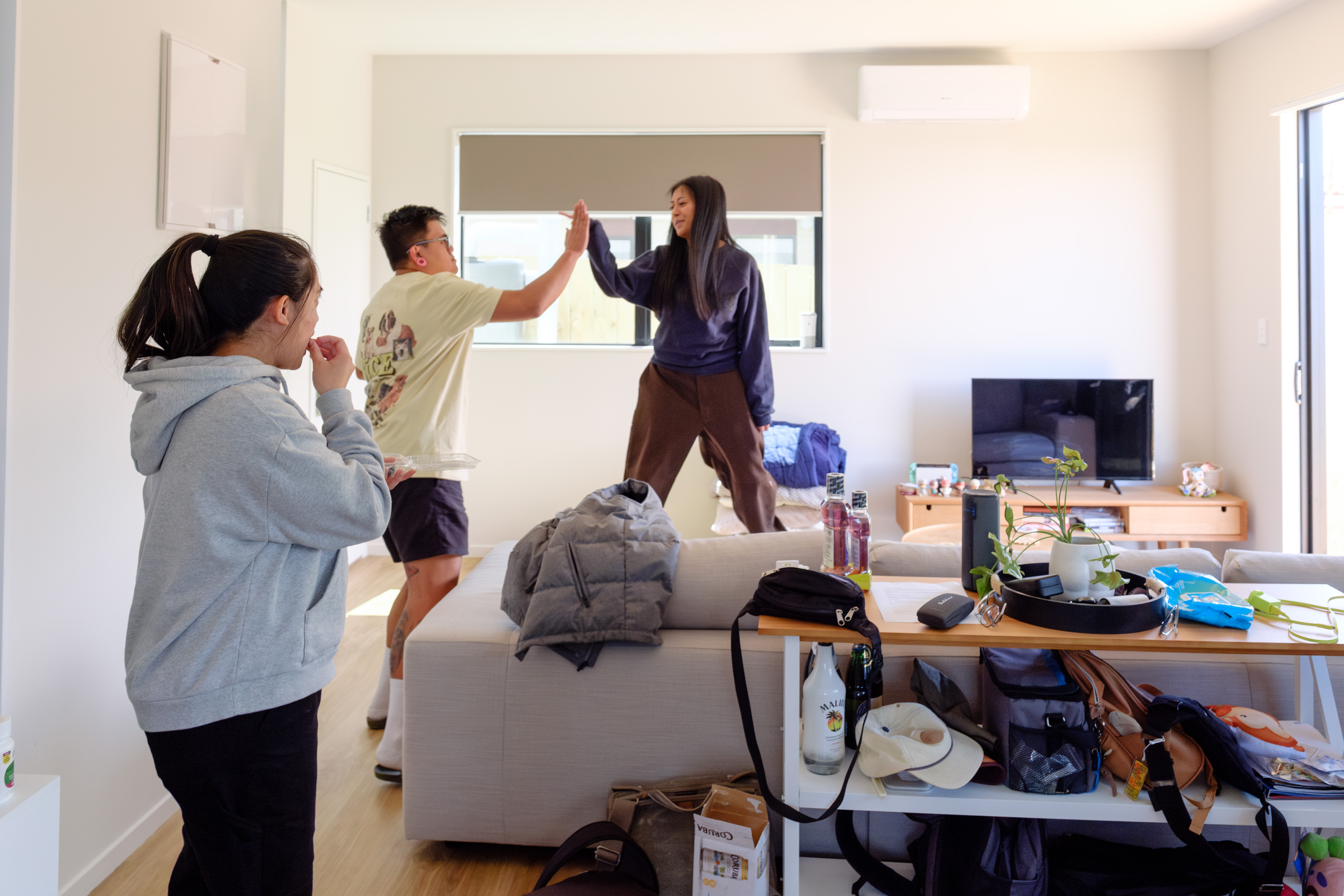 Kevin, JC and Donna in their Auckland home