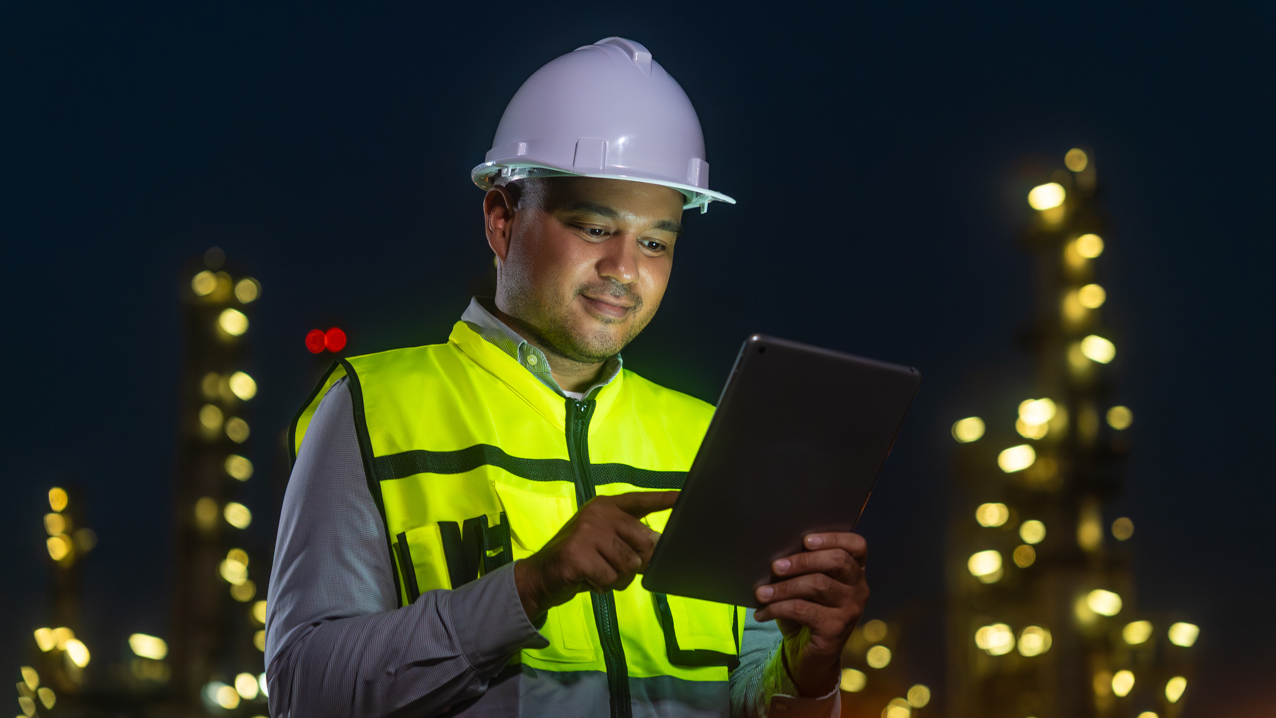 Male construction worker at night