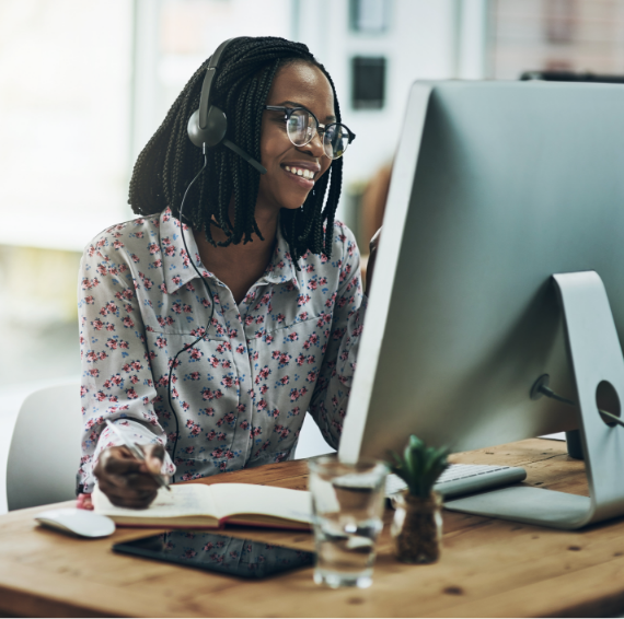 Smiling woman on computer