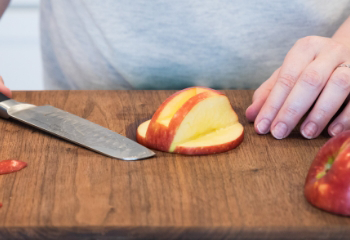 Apple showing the section cut out of the half slice top portion of the apple