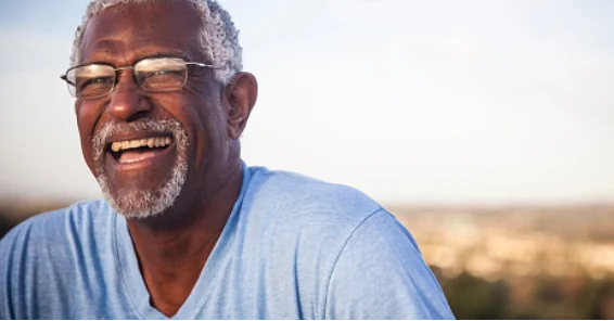 Man smiling wearing glasses
