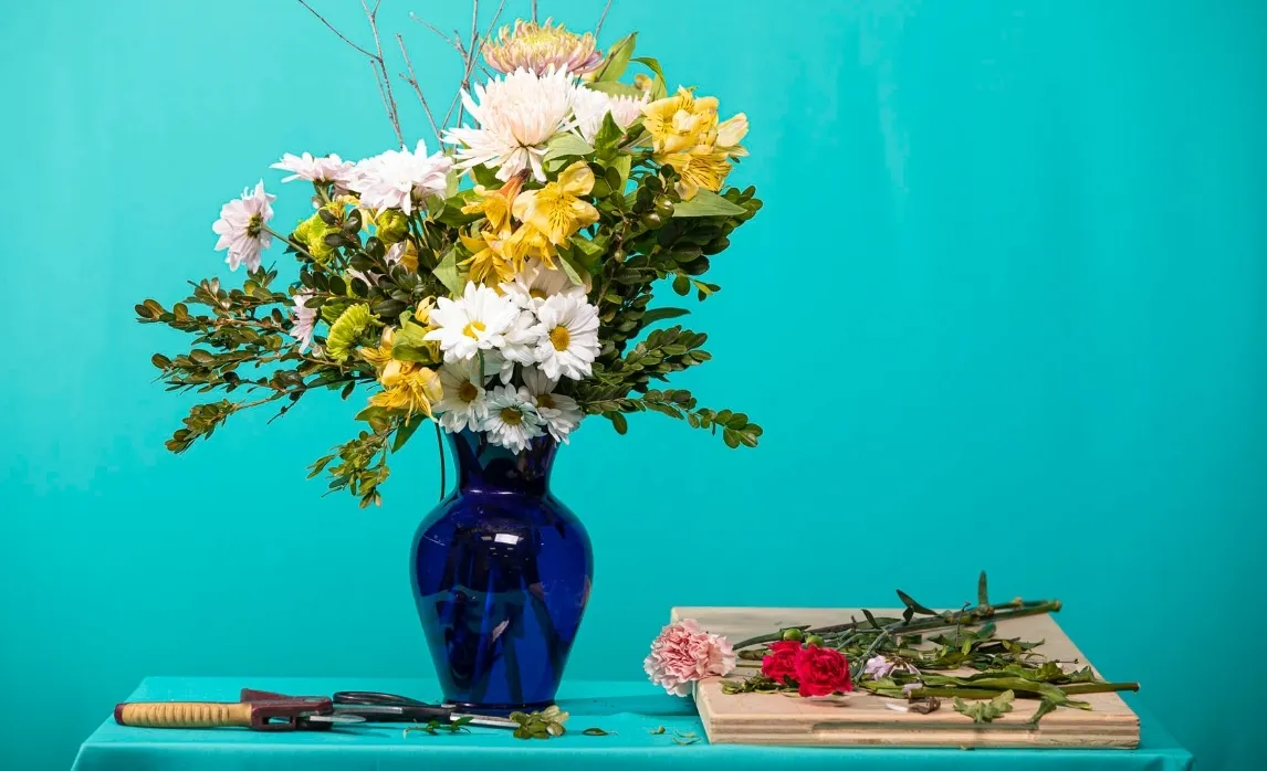 Vase Filled with Flowers Sitting on a Table