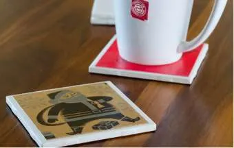 tile coasters on a wood table 