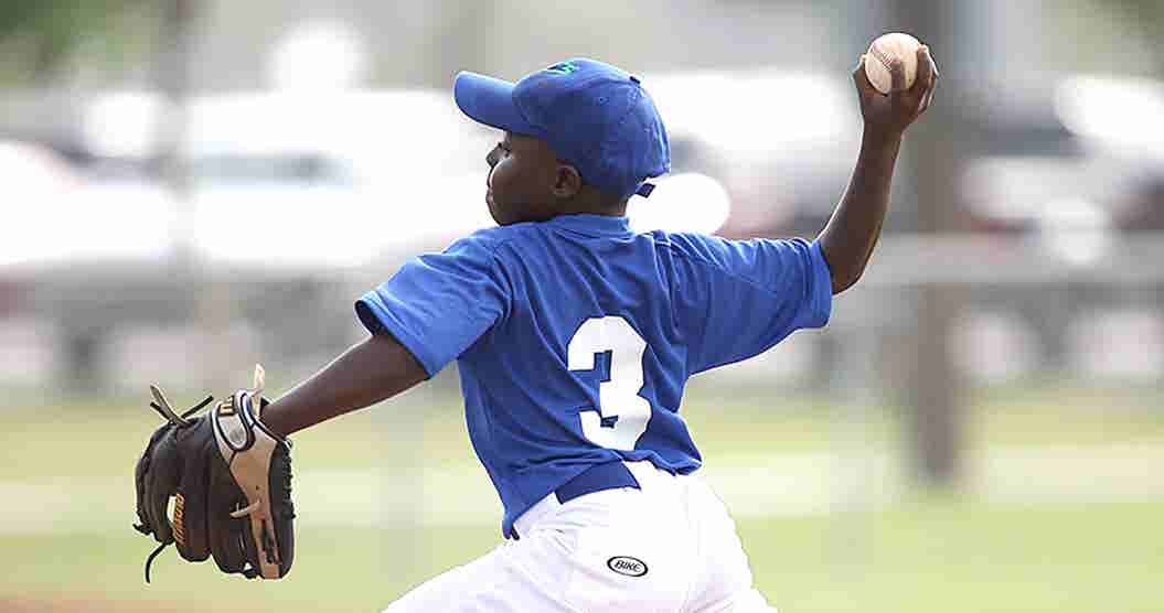 Young boy throwing a baseball.