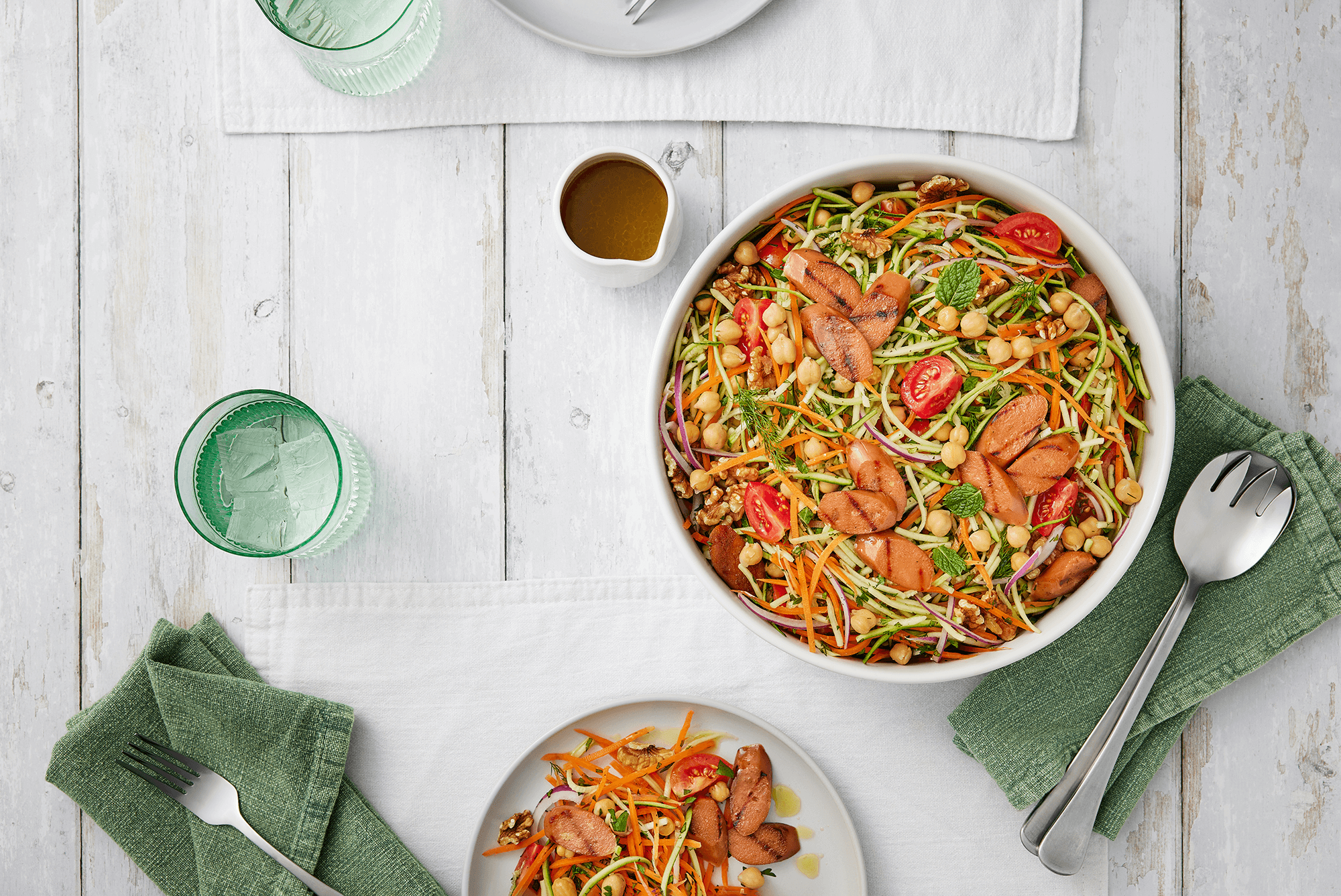 Sunny rainbow salad with vegie sausages