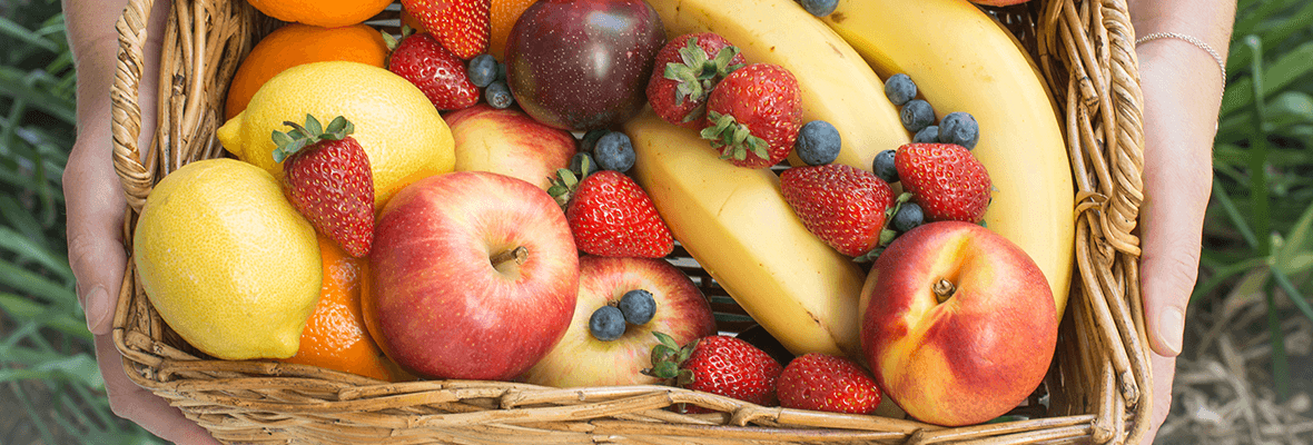 fruit basket with bananas, apples, strawberries