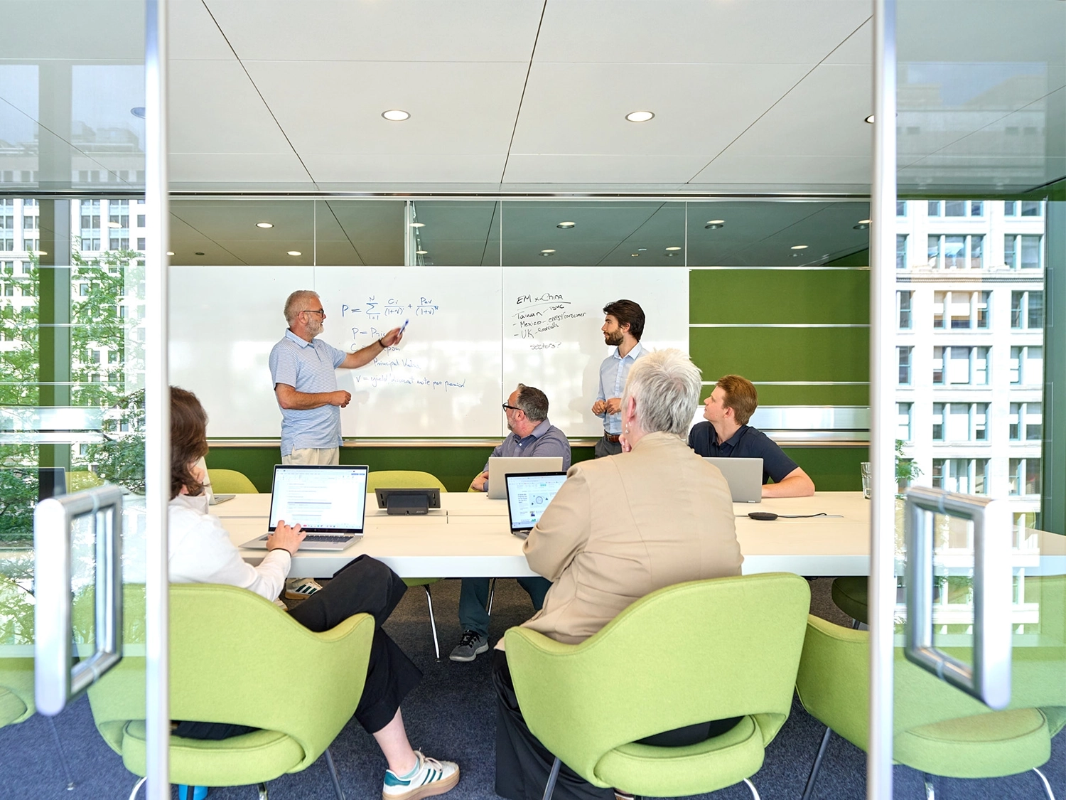 Morningstar researchers and editors collaborate around a conference table.