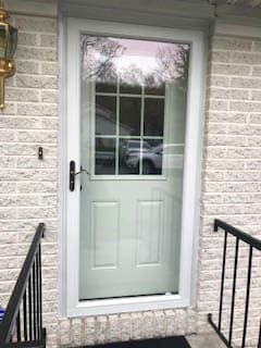 New white fiberglass side entry door with storm door