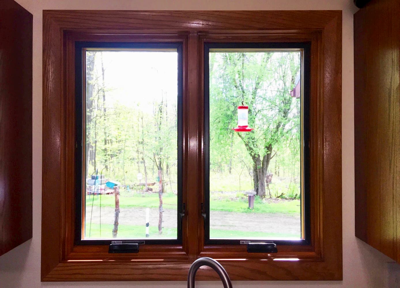 Interior view of new wood casement windows over kitchen sink.