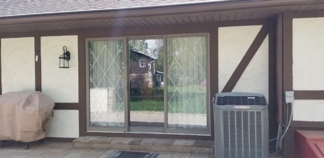 outdated brown framed sliding glass door before renovation