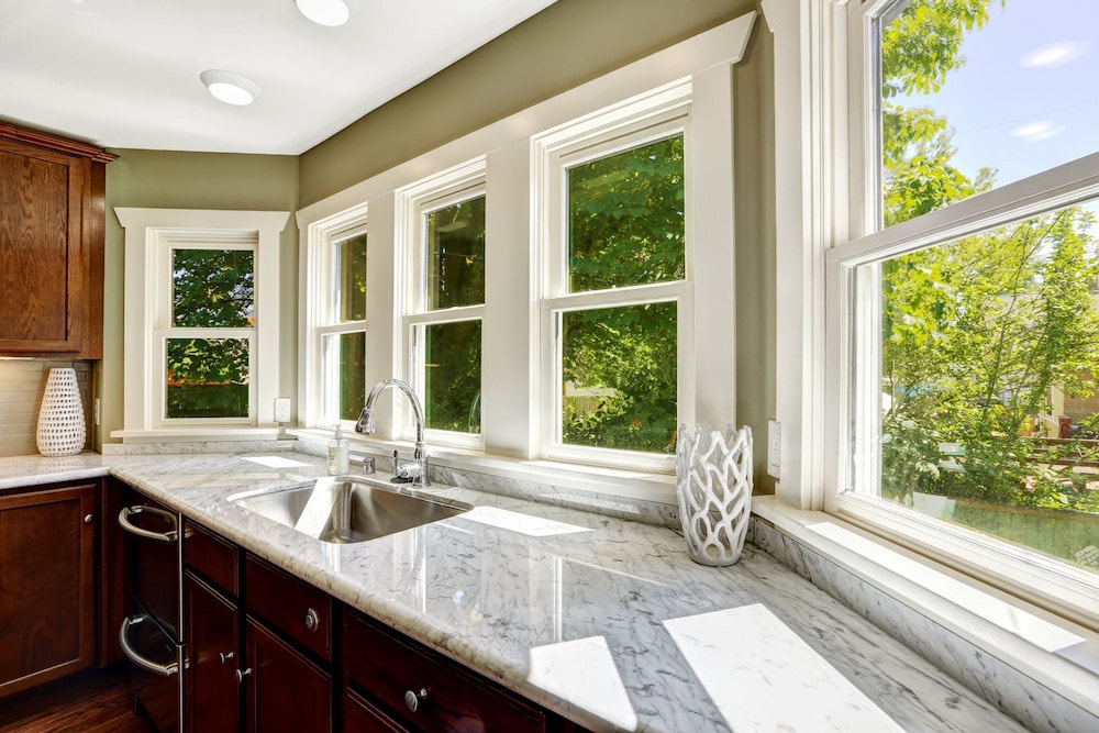 Kitchen with wood double-hung windows