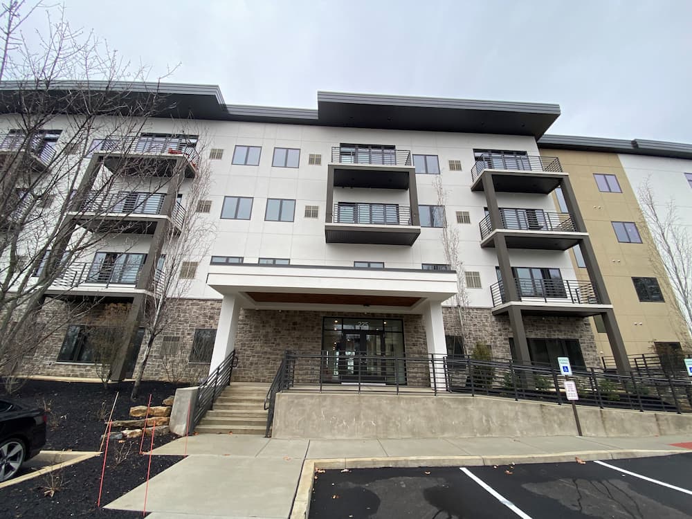Side view of new apartment building featuring Pella wood patio doors and fiberglass windows