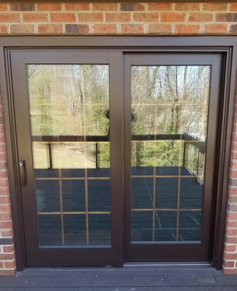 New wood sliding glass door with traditional grille pattern