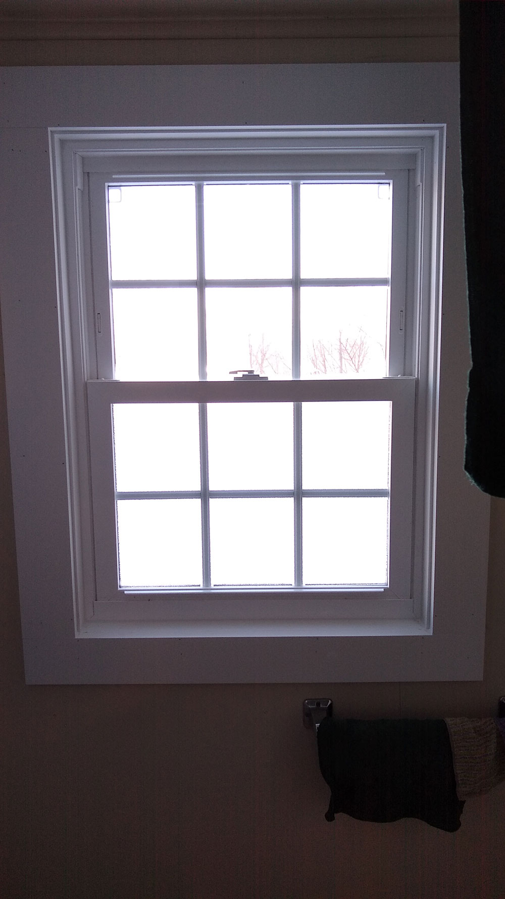 New sliding vinyl window in century home in Hadley, MA