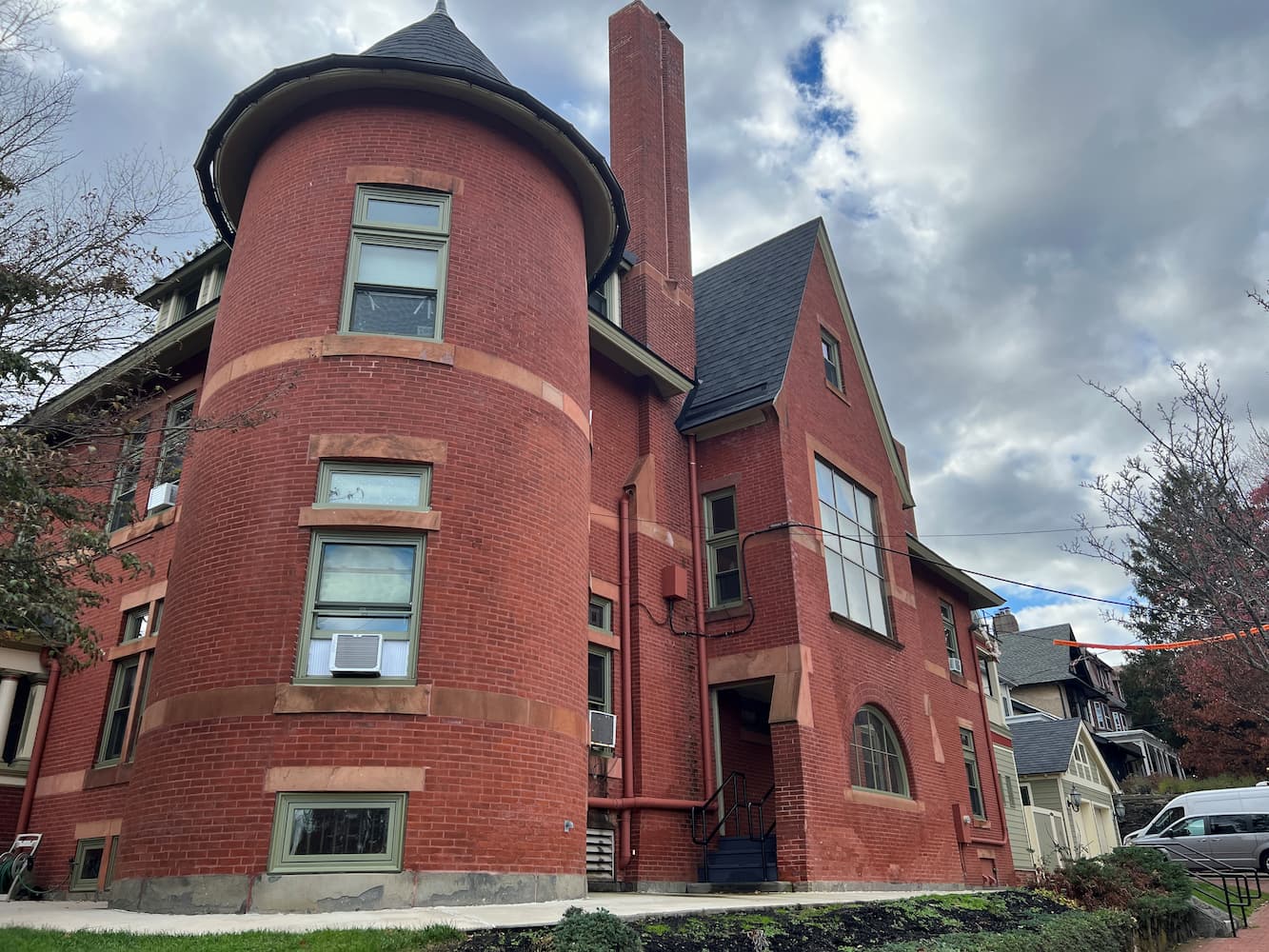 Red brick historic building featuring turret that has all new Pella wood windows