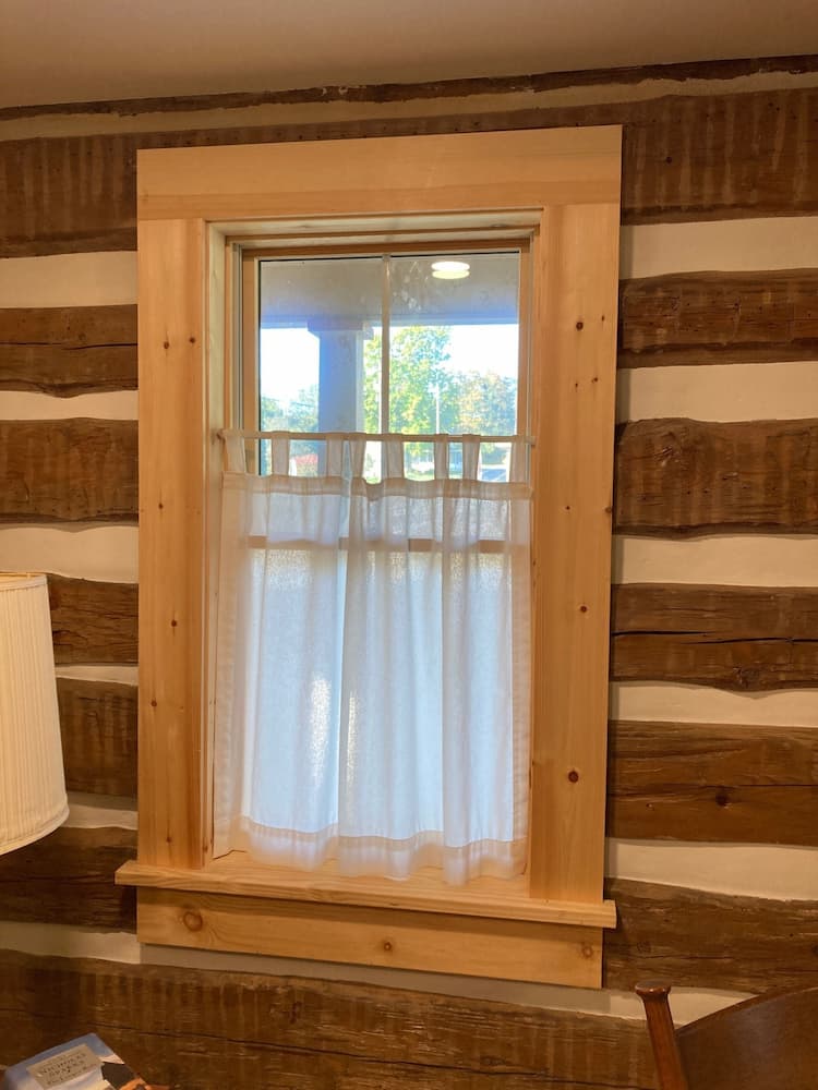 Interior view of wood windows featuring a natural wood frame