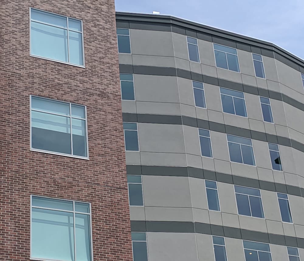Apartment complex with fixed and casement fiberglass windows