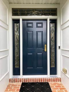 Navy blue fiberglass entry door with transom window and sidelights