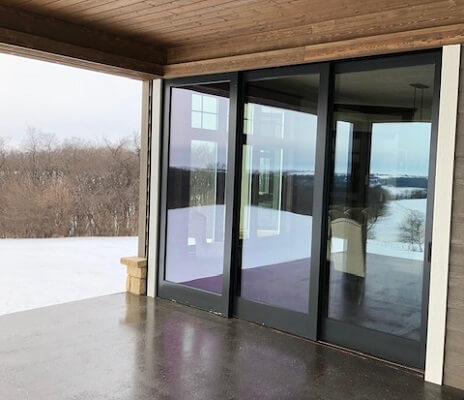 outside view of dubuque home with new wood windows and multi slide patio door