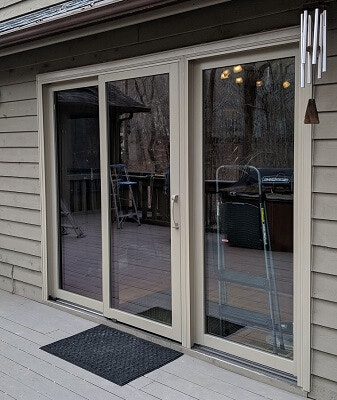 sliding patio door in midlothian home with new wood casement windows