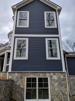 side of midlothian home with new wood double hung windows