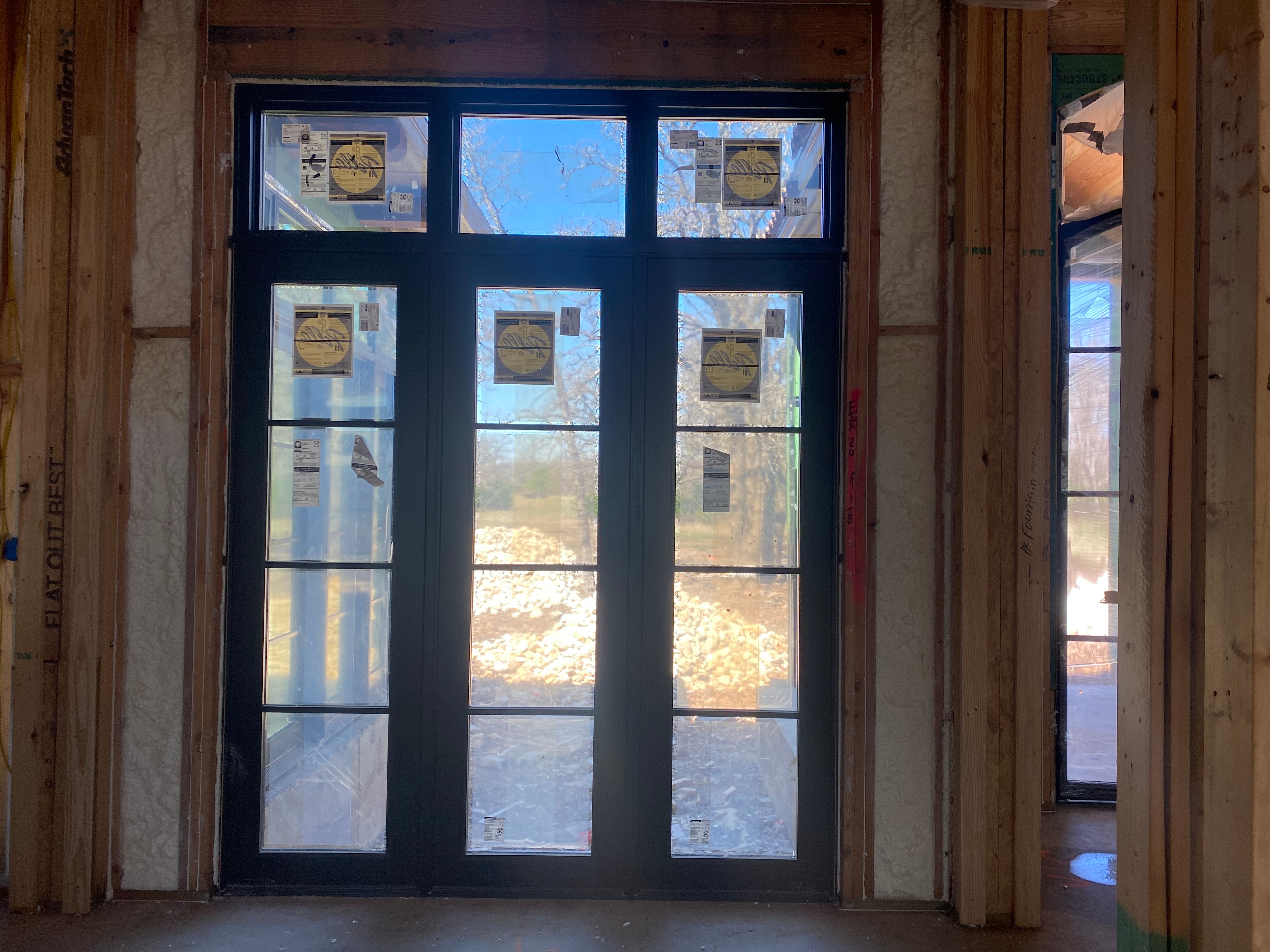 Hinged patio doors and awning windows on new construction in Austin