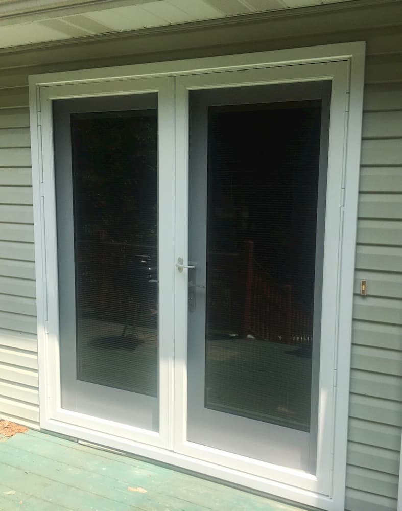 New wood hinged French patio doors 