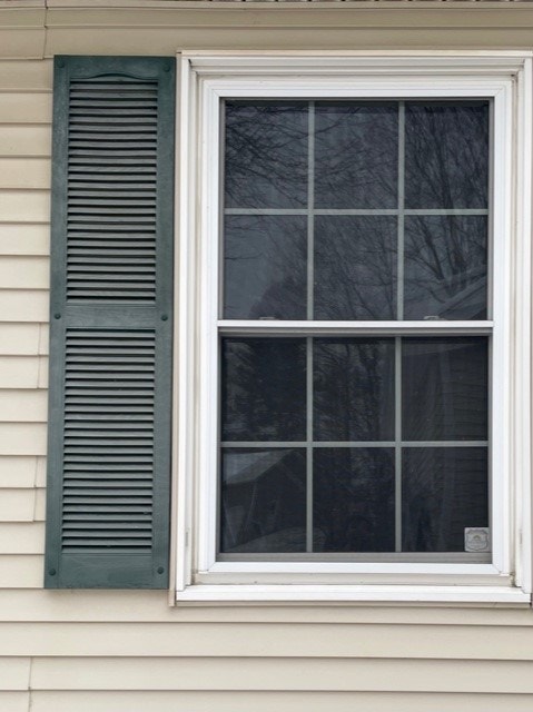 Before photo of existing double-hung windows
