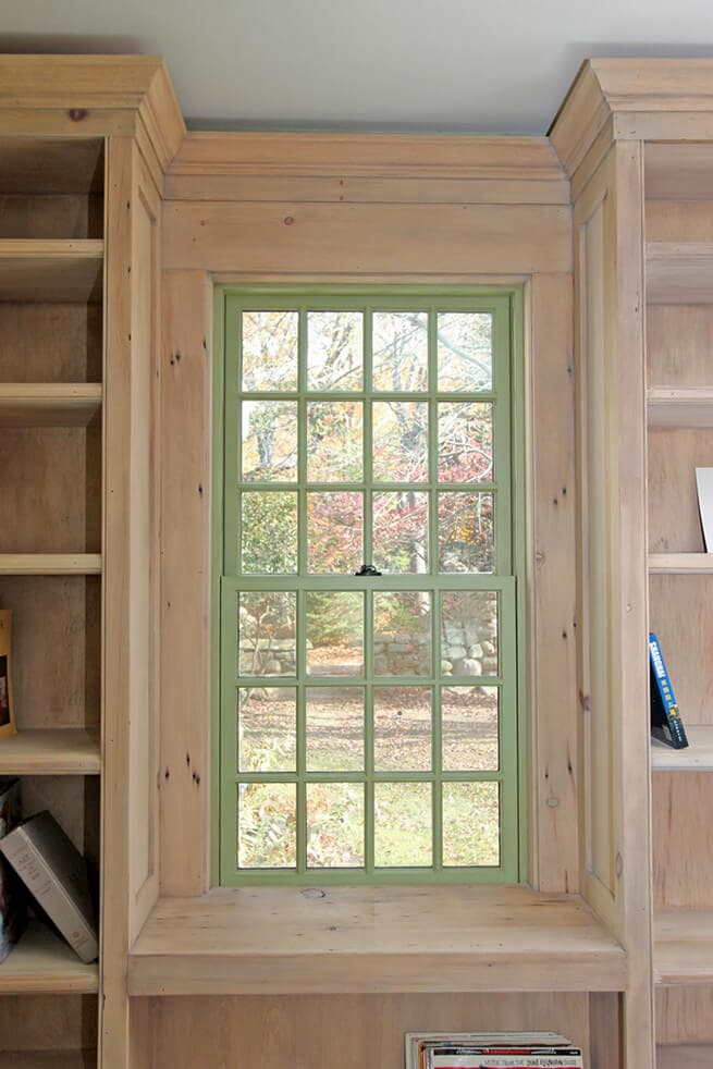Interior view of wood double-hung window with sage green finish