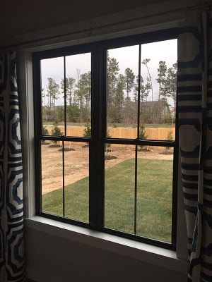 dining room view in virginia home with new black fiberglass double hung windows