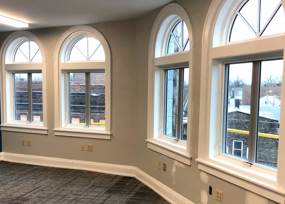 Interior view of new wood casement and half-arch windows